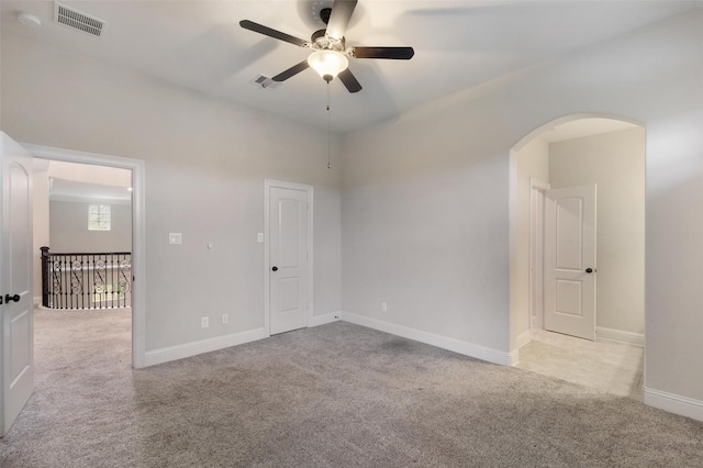 carpeted empty room with ceiling fan