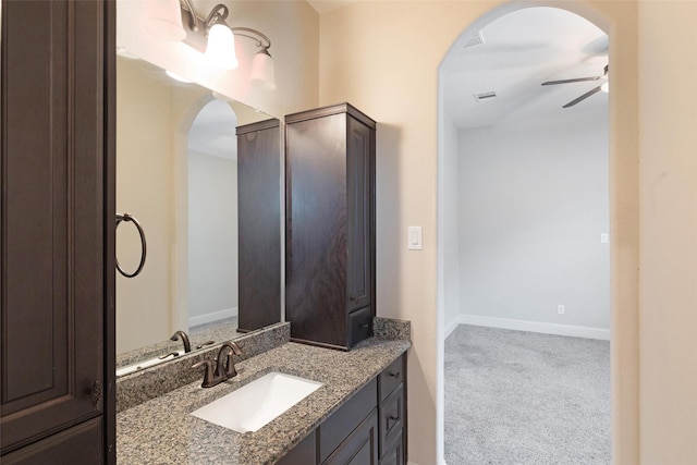 bathroom featuring ceiling fan and vanity