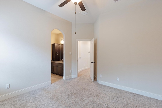 empty room with light carpet and ceiling fan