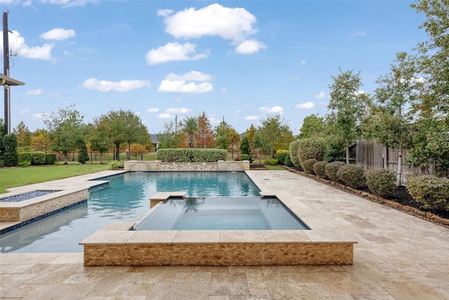 view of pool with an in ground hot tub