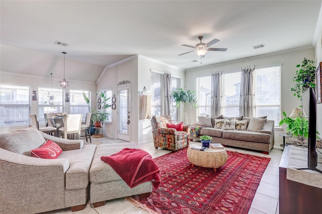 tiled living room featuring ceiling fan, a healthy amount of sunlight, lofted ceiling, and crown molding