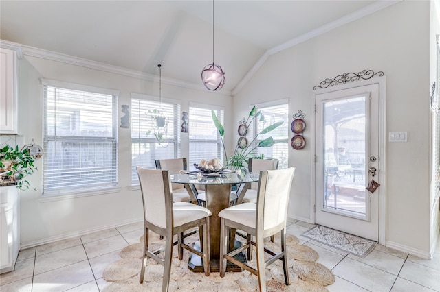 dining space with light tile patterned flooring, lofted ceiling, and ornamental molding