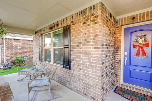 view of exterior entry featuring a porch