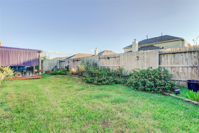 view of yard with a wooden deck