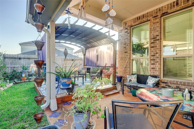 view of patio with outdoor lounge area and a pergola