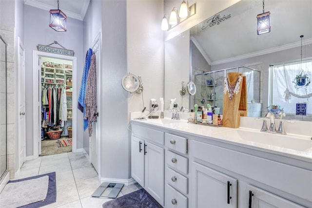 bathroom featuring tile patterned floors, vanity, an enclosed shower, and ornamental molding