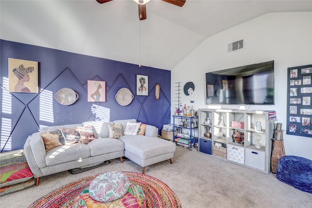 living room with ceiling fan, carpet, and vaulted ceiling