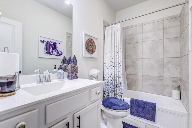 full bathroom with vanity, shower / bath combo, and toilet