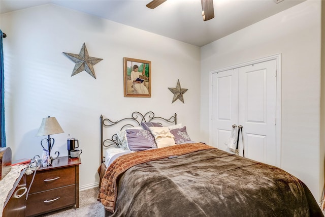 bedroom with carpet floors, a closet, and ceiling fan