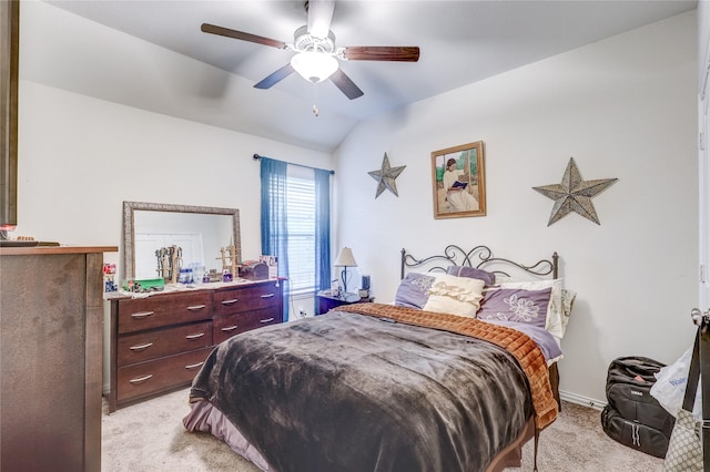 bedroom featuring ceiling fan, light colored carpet, and lofted ceiling