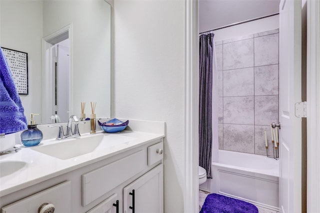 full bathroom featuring shower / bath combination with curtain, toilet, and vanity