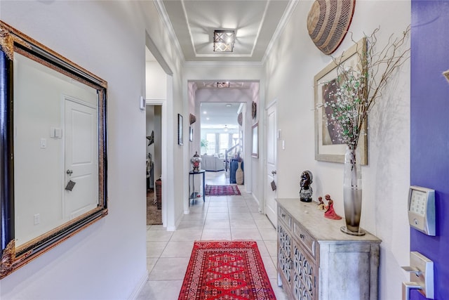 corridor with ornamental molding and light tile patterned floors