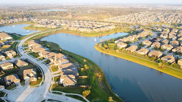 birds eye view of property featuring a residential view and a water view
