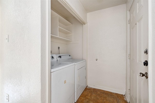 clothes washing area with washing machine and clothes dryer