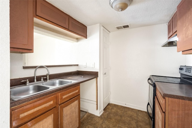 kitchen with dark countertops, stainless steel electric range, and brown cabinets