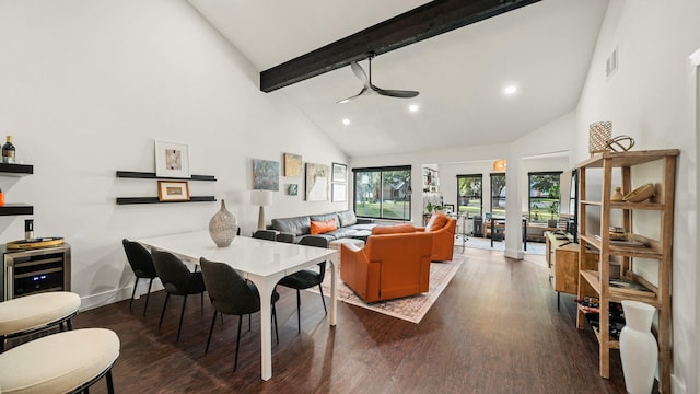 dining area featuring ceiling fan, beam ceiling, dark hardwood / wood-style flooring, and high vaulted ceiling