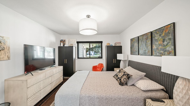 bedroom featuring dark hardwood / wood-style floors