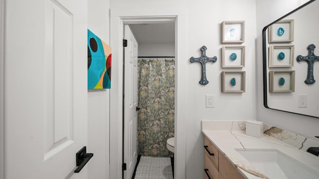 bathroom with vanity and toilet