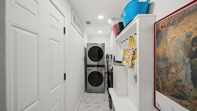 laundry area with stacked washer and dryer