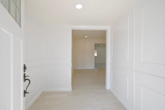 corridor featuring light tile patterned flooring