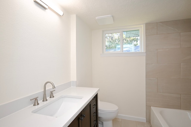 bathroom featuring vanity, a textured ceiling, toilet, and tile patterned flooring