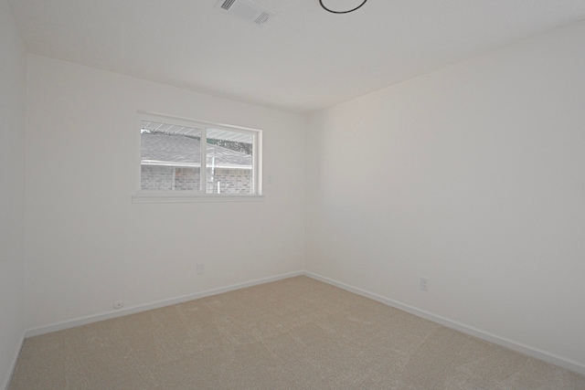 spare room featuring carpet flooring