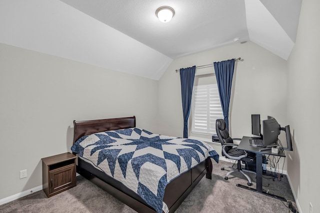 carpeted bedroom with vaulted ceiling