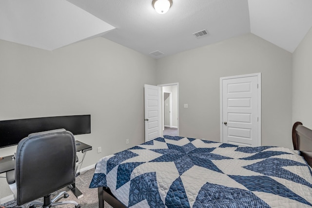 bedroom featuring carpet flooring and vaulted ceiling