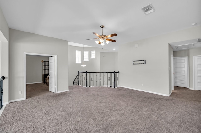 empty room with carpet flooring and ceiling fan