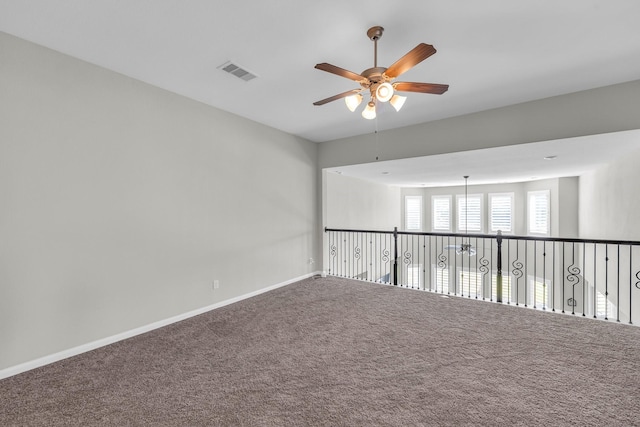 spare room with carpet and ceiling fan