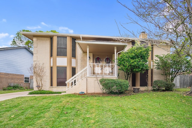 view of front of home featuring a front yard and a porch