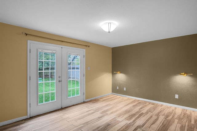 entryway featuring french doors and light hardwood / wood-style flooring