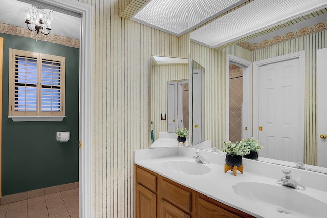 bathroom featuring vanity, tile patterned floors, and a notable chandelier