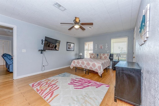 bedroom with ceiling fan and wood-type flooring