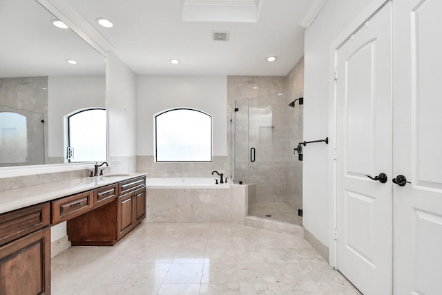 bathroom featuring separate shower and tub and vanity