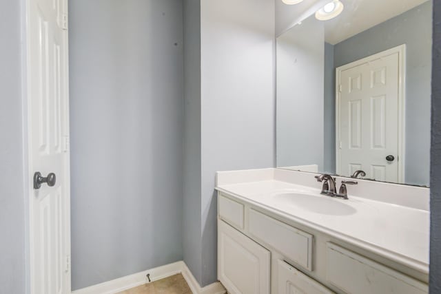 bathroom with tile patterned flooring and vanity