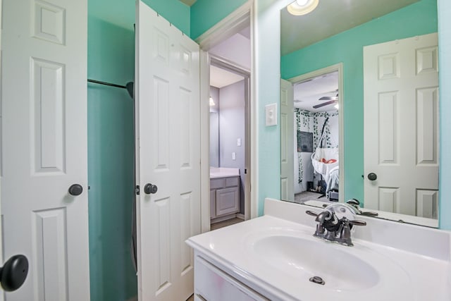 bathroom with ceiling fan and vanity