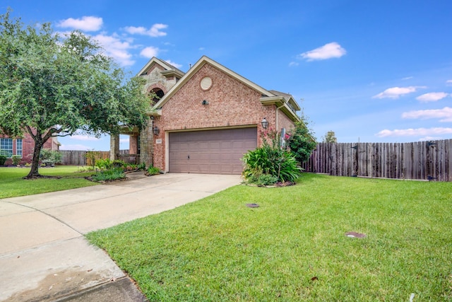 view of front of house with a front yard and a garage