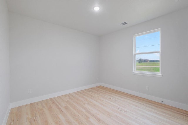 unfurnished room featuring light wood-type flooring