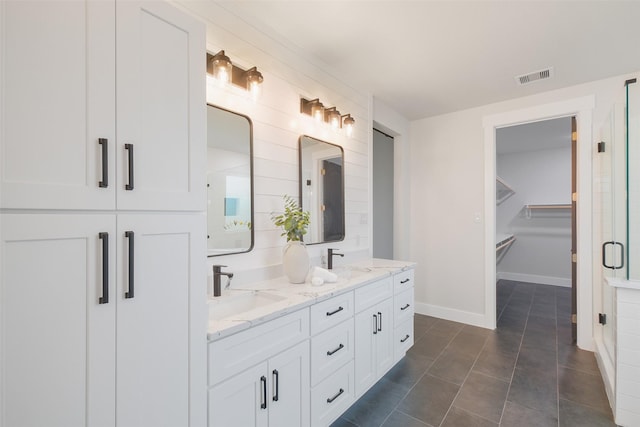 bathroom featuring tile patterned flooring and vanity