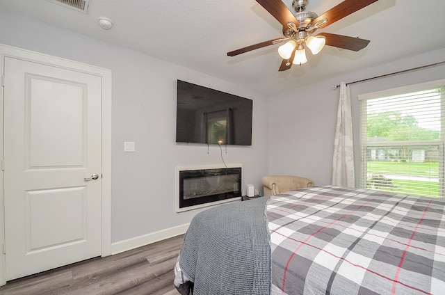 bedroom featuring ceiling fan and wood-type flooring