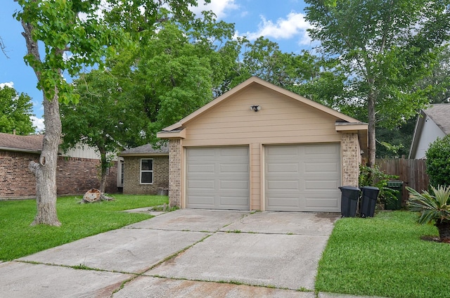 single story home featuring a front lawn and a garage