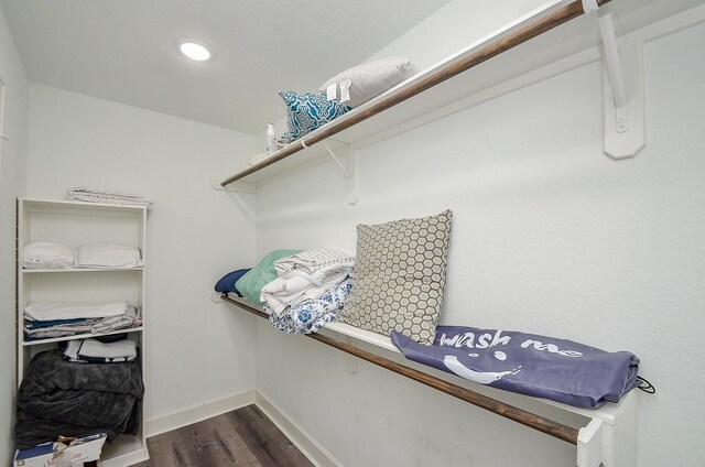 walk in closet featuring dark hardwood / wood-style floors