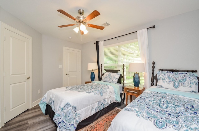 bedroom with hardwood / wood-style floors and ceiling fan