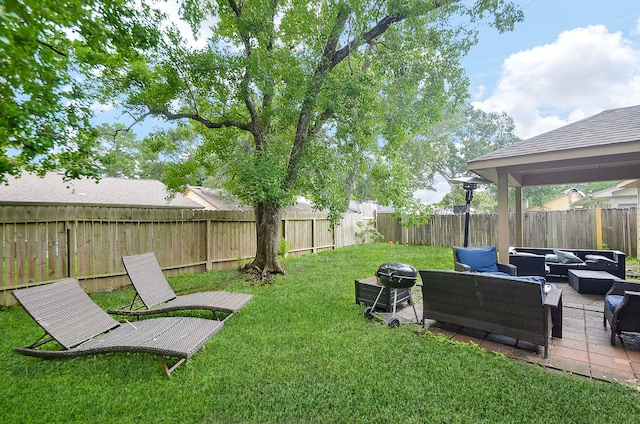 view of yard with an outdoor living space and a patio