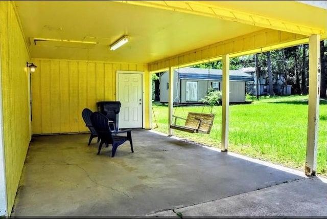 view of patio featuring an outbuilding