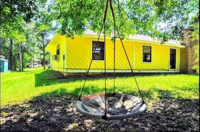 view of side of property featuring an outdoor fire pit