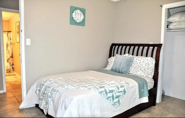 bedroom featuring light tile patterned floors