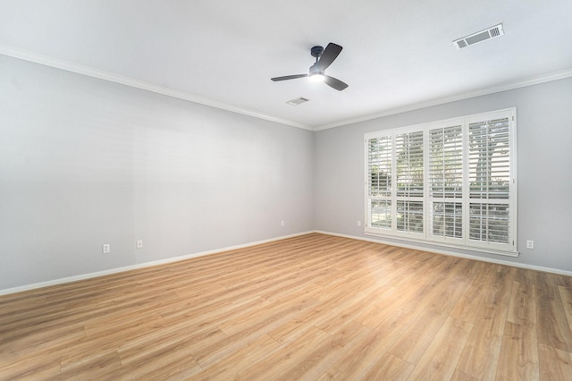 empty room featuring light hardwood / wood-style flooring, ceiling fan, and ornamental molding