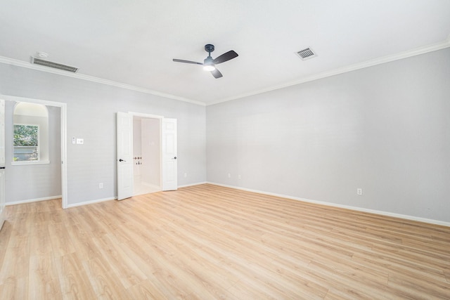 empty room featuring light hardwood / wood-style flooring, ceiling fan, and crown molding